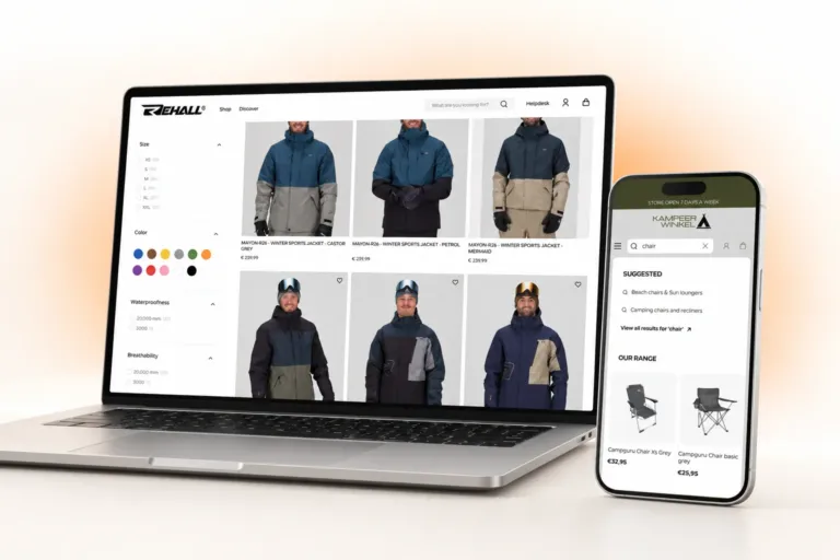 Laptop showing Rehall's men's ski jacket collection with size, colour, waterproofness and breathability filters, beside a phone showing Kampeerwinkel Roermond's predictive search results for 'chair'